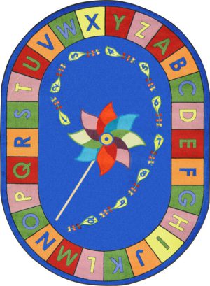 An oval educational kids rug with a pinwheel in the center and the alphabet around the edge.