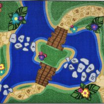 A kids rug with a trail and the alphabet with numbers on stones in the middle
