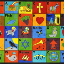 A faith based educational rug with biblical symbols and English alphabet.