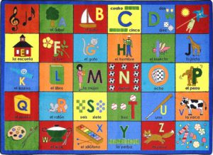 A Spanish bilingual kids rug with the alphabet in different spaces.