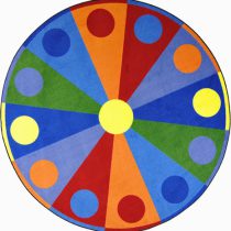 A round childrens rug with different colors and circles around the edge