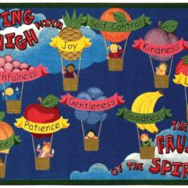 A childrens rug with fruit as hot air balloons with kids in baskets. The rug says flying high with the fruits of the spirit.
