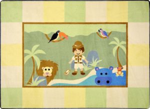 A baby rug with a whimsical explorer boy, lion, hippo and birds.