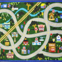A kids play rug with roads, train tracks and a town.