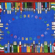 A blue educational rug with the alphabet in the middle and books around the edge.
