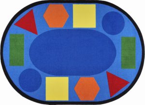An oval classroom seating rug with fun shapes in different colors around the edge of the rug.