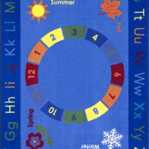 A blue educational kids rug with seasons, numbers and alphabet in upper and lower case.